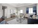 Bright living room featuring modern decor, a sliding glass door, and comfortable seating at 10786 Bear Cub Dr, Broomfield, CO 80021