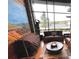 Cozy living room featuring large windows, stylish furniture, and chic decor with art at 10786 Bear Cub Dr, Broomfield, CO 80021