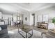Open-concept floor plan showcases a living room and kitchen with natural light and modern finishes at 10786 Bear Cub Dr, Broomfield, CO 80021