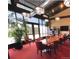 Well-lit meeting room with large windows, long table and chairs, and decorative lighting at 10786 Bear Cub Dr, Broomfield, CO 80021