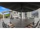 Outdoor dining set and grill on the deck, perfect for enjoying outdoor meals and entertaining guests at 688 Cinnabar Ln, Castle Rock, CO 80108