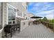 Deck area with outdoor grill, dining set, and comfortable seating at 688 Cinnabar Ln, Castle Rock, CO 80108