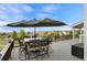 Outdoor dining set on a spacious deck, offering scenic views and an ideal space for entertainment at 688 Cinnabar Ln, Castle Rock, CO 80108