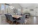 Dining area with large table and chairs, flowing into the living room at 688 Cinnabar Ln, Castle Rock, CO 80108