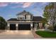 Charming two-story home with a three-car garage and well-manicured lawn at 688 Cinnabar Ln, Castle Rock, CO 80108