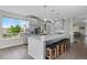 Modern kitchen with a large island, ample counter space, and pendant lighting at 688 Cinnabar Ln, Castle Rock, CO 80108