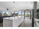 Open kitchen features a large island, modern appliances and access to the living room at 688 Cinnabar Ln, Castle Rock, CO 80108