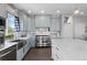 An impressive kitchen with stainless steel appliances and a large center island at 688 Cinnabar Ln, Castle Rock, CO 80108