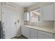 Laundry room has storage and a sink at 688 Cinnabar Ln, Castle Rock, CO 80108