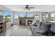 Cozy living room features a fireplace and a large window with a beautiful view at 688 Cinnabar Ln, Castle Rock, CO 80108