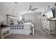 Bright main bedroom with a ceiling fan, carpeted floors, and plantation shutters at 688 Cinnabar Ln, Castle Rock, CO 80108
