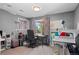 Home office with natural light, a view of the backyard, and featuring a sewing machine and work space at 688 Cinnabar Ln, Castle Rock, CO 80108