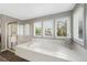 Bright bathroom featuring a jacuzzi tub and glass enclosed shower at 85 Willowleaf Dr, Littleton, CO 80127