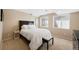 Comfortable bedroom with neutral colors, plush carpet, and plenty of natural light at 85 Willowleaf Dr, Littleton, CO 80127