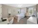 Bright bedroom featuring a cozy window seat, a modern ceiling fan, and neutral decor at 85 Willowleaf Dr, Littleton, CO 80127