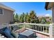 Relaxing deck area with lounge chair overlooking lush greenery at 85 Willowleaf Dr, Littleton, CO 80127