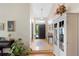 Welcoming entryway with hardwood floors, a stylish pendant light, and neutral decor at 85 Willowleaf Dr, Littleton, CO 80127