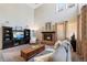 Comfortable living room with a stone fireplace, plush seating, and plenty of natural light at 85 Willowleaf Dr, Littleton, CO 80127