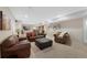 Spacious living room with neutral carpet, and comfortable seating, perfect for gatherings at 85 Willowleaf Dr, Littleton, CO 80127