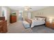 Spacious main bedroom featuring a sitting area, a ceiling fan, and carpet at 85 Willowleaf Dr, Littleton, CO 80127