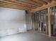 Unfinished basement showing stud framing with an insulated wall, ready for personalization and customization at 10178 Hutch Ln, Conifer, CO 80433