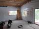Unfinished basement, with bright window looking out onto the landscape, awaiting customization at 10178 Hutch Ln, Conifer, CO 80433