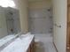 Bathroom features granite counters, wood cabinet, and tile shower/bath at 10178 Hutch Ln, Conifer, CO 80433
