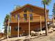 Well-maintained wood house with a large deck, inviting outdoor gatherings and relaxation at 10178 Hutch Ln, Conifer, CO 80433