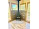 Cozy living area with an updated stone fireplace and access to a wooden deck at 10178 Hutch Ln, Conifer, CO 80433