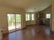 Bright living room featuring wood floors, exterior deck access and a kitchen at 10178 Hutch Ln, Conifer, CO 80433