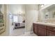 A spacious bedroom and adjoining bathroom displaying serene colors and design, providing a peaceful atmosphere at 924 Brookhurst Ave # C, Highlands Ranch, CO 80129