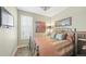 Cozy bedroom with shuttered windows, patterned bedding, and a wrought iron bed frame at 924 Brookhurst Ave # C, Highlands Ranch, CO 80129