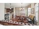 Dining room featuring a chandelier, bench seating, and views into the kitchen at 924 Brookhurst Ave # C, Highlands Ranch, CO 80129