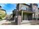 Stylish townhome with brick accents and covered front porch at 924 Brookhurst Ave # C, Highlands Ranch, CO 80129