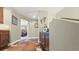 Hallway with wood floors, cowhide rug, and view into bedroom with a comfortable bed at 924 Brookhurst Ave # C, Highlands Ranch, CO 80129