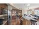 Spacious kitchen featuring stainless steel appliances, stone countertops, and ample storage at 924 Brookhurst Ave # C, Highlands Ranch, CO 80129