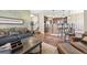 Bright open-concept living room featuring hardwood floors, bar seating, and comfortable furnishings at 924 Brookhurst Ave # C, Highlands Ranch, CO 80129