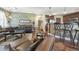 Open concept living area with hardwood floors and breakfast bar at 924 Brookhurst Ave # C, Highlands Ranch, CO 80129