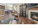 Hardwood living area with a fireplace, breakfast bar, and a dining space at 924 Brookhurst Ave # C, Highlands Ranch, CO 80129