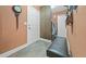Spacious mudroom with tile flooring, front-loading washer and dryer, and a comfortable bench at 924 Brookhurst Ave # C, Highlands Ranch, CO 80129
