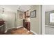 Home office with custom wood desk, built-in shelves, and natural lighting at 924 Brookhurst Ave # C, Highlands Ranch, CO 80129