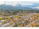Picturesque aerial view of the town with mountain range and colorful fall foliage at 224 S Ridge St, Breckenridge, CO 80424