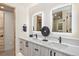 Bathroom with dual sinks, sleek fixtures, and lighted mirrors at 224 S Ridge St, Breckenridge, CO 80424