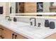 This bathroom boasts a clean design featuring marble countertops and double sinks for a functional and stylish space at 224 S Ridge St, Breckenridge, CO 80424