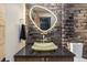 Chic bathroom features textured tile walls, a unique vessel sink, and modern fixtures for a spa-like experience at 224 S Ridge St, Breckenridge, CO 80424