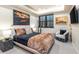 Comfortable bedroom boasts a modern design and warm, inviting decor, plus mountain artwork at 224 S Ridge St, Breckenridge, CO 80424