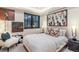 Comfortable bedroom with stylish accents, artwork, and a cozy chair by the window at 224 S Ridge St, Breckenridge, CO 80424
