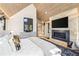 This bedroom boasts modern finishes, including a fireplace and decorative artwork that create a warm and inviting atmosphere at 224 S Ridge St, Breckenridge, CO 80424