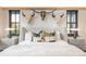 Beautifully staged bed in front of three decorative bull skulls creates a focal point above the luxurious primary suite bedding at 224 S Ridge St, Breckenridge, CO 80424