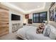 This cozy bedroom has neutral tones and features a mounted tv for relaxing entertainment at 224 S Ridge St, Breckenridge, CO 80424
